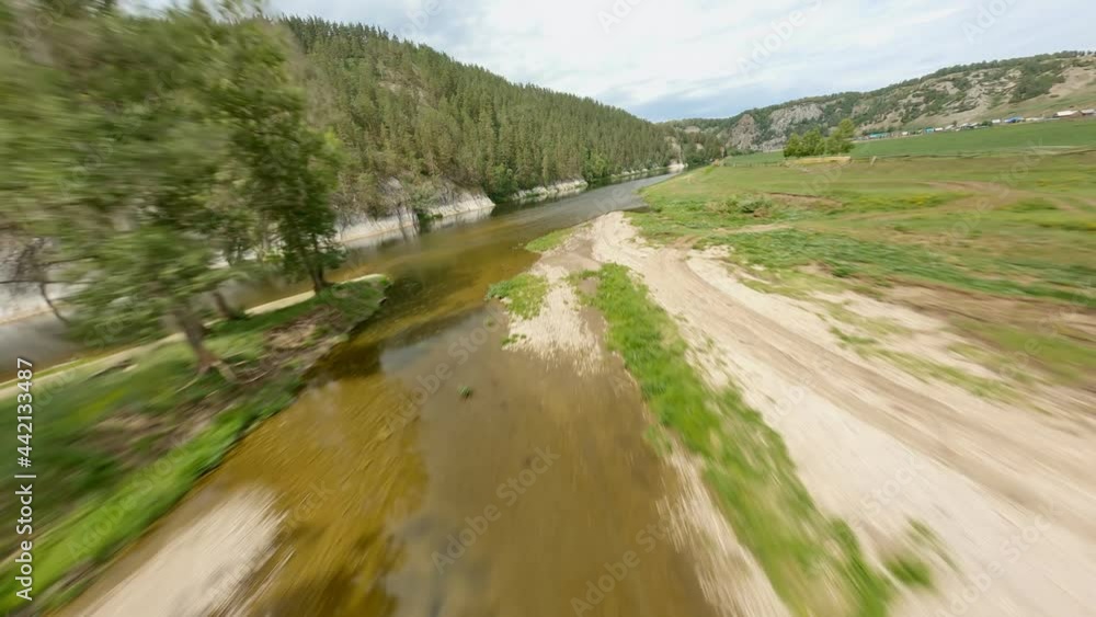 The river bed is close-up. Calm water. The mountains are overgrown with coniferous trees. Ensuring the safety of flora and fauna in the territory. The development of ecotourism. High quality. The river bed is close-up. Calm water. The mountains are overgrown with coniferous trees. Ensuring the safety of flora and fauna in the territory. The development of ecotourism. High quality.