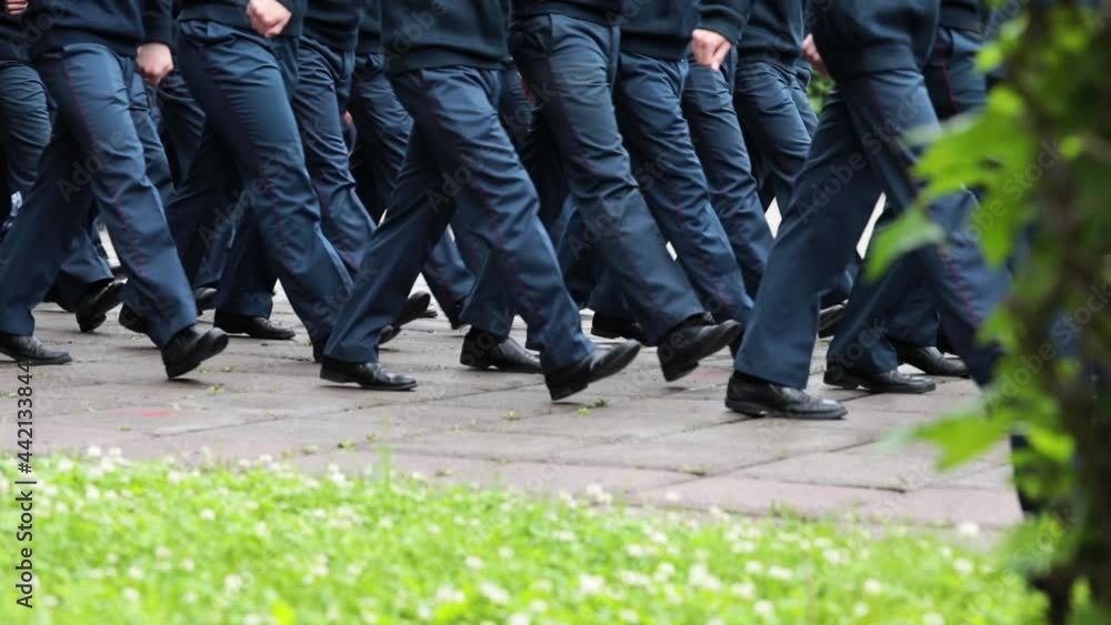 Men in military uniforms march on the parade ground on a cloudy summer day. Federal Service for the Execution of Punishments in Russia. Men in military uniforms march on the parade ground on a cloudy summer day. Federal Service for the Execution of Punishments in Russia.