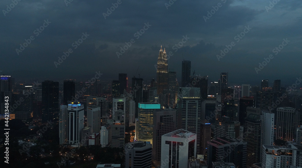 Fototapeta premium AERIAL. Cinematic view. Hight view to Kuala Lumpur city, Malaysia. Cityscape business skyscrapers night downtown.
