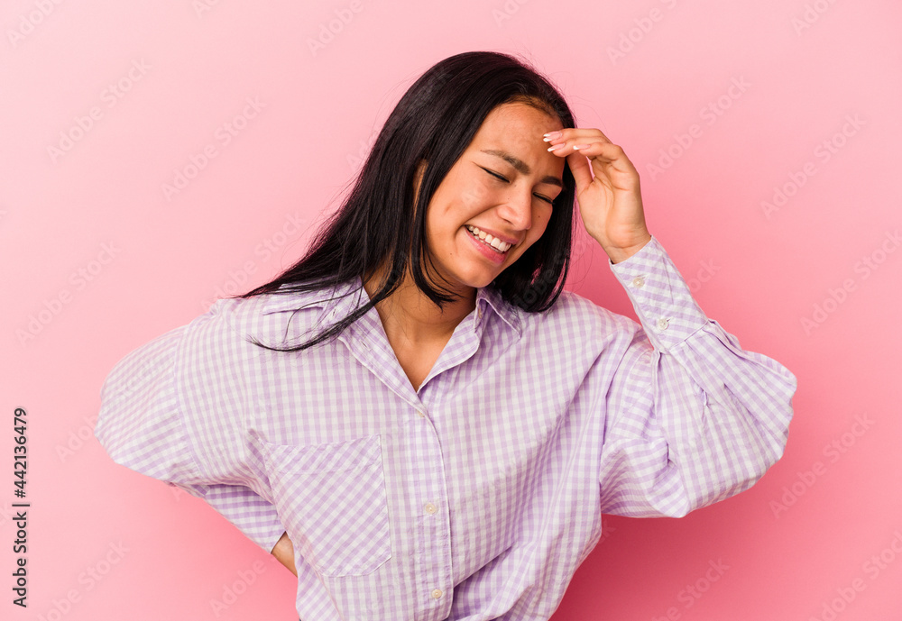 Young Venezuelan woman isolated on pink background joyful laughing a lot. Happiness concept. Young Venezuelan woman isolated on pink background joyful laughing a lot. Happiness concept.