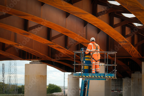 Construction Workers working at height on a new bridge which is part of the Western Distributor Road in Preston, UK.