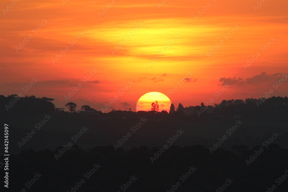 Obraz premium sunset in the mountains over the florest