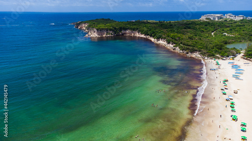 beautiful beach where you can see something similar to a peninsula and the beautiful green water beaches