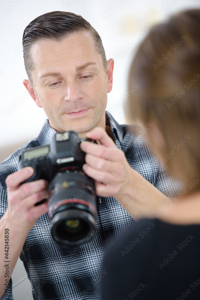 man is using a high powered camera man is using a high powered camera