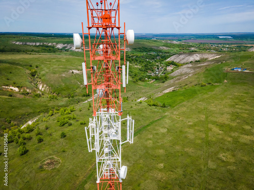 Technology on the top of the telecommunication GSM 5G and 4G tower. Cellular phone antennas countryside. Telecommunication mast television antennas.