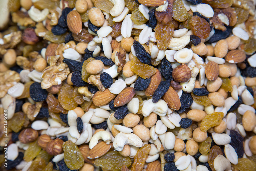 Nut mixture of raisins, walnuts, cashews, hazelnuts, selective focus. Fruits nuts vegetables berries useful products agriculture agriculture. Nut mixture of raisins, walnuts, cashews, hazelnuts, selective focus. Fruits nuts vegetables berries useful products agriculture agriculture.