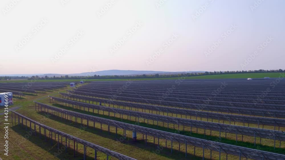 A large autonomous solar power plant replaces the industrial network. Providing energy to consumers, stocking up excess energy in batteries. High quality. 4k footage. A large autonomous solar power plant replaces the industrial network. Providing energy to consumers, stocking up excess energy in batteries. High quality. 4k footage.