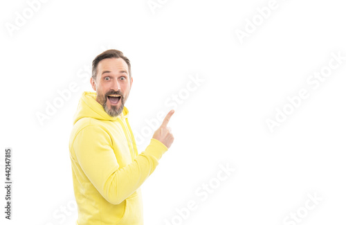 happy man in hoody pointing finger on copy space isolated on white, suggest.