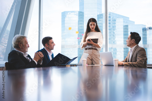 men and women in meeting ro...