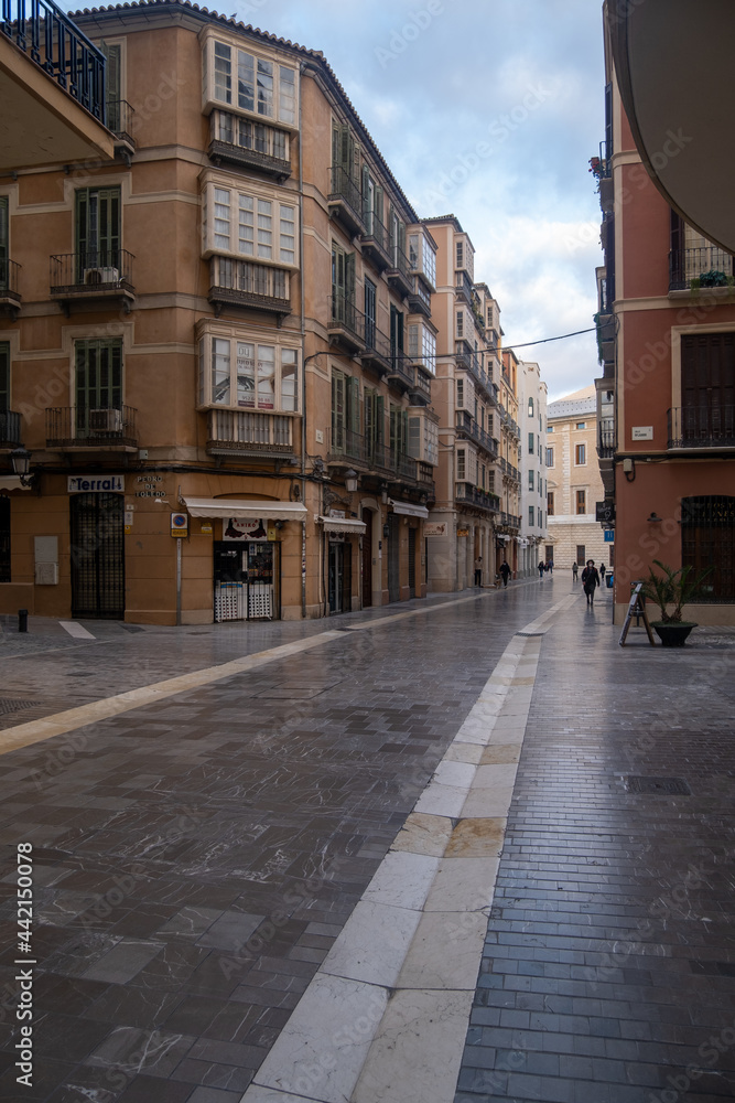 Málaga, Spain - February 23, 2021: View of people walking the streets of the historic center of Malaga during the pandemic