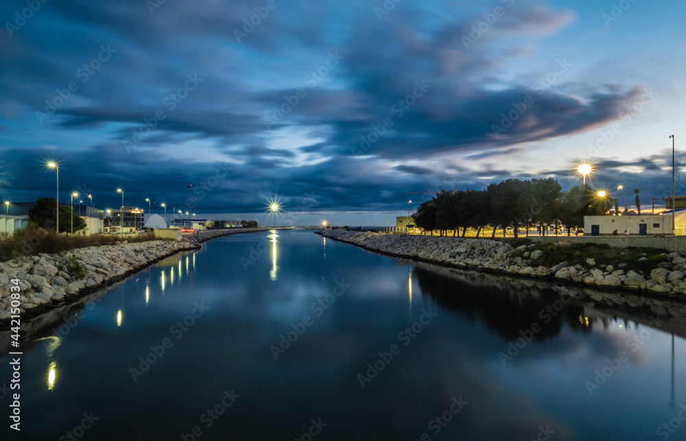View of the Guadalmedina river in the port of Malaga at night. View of the Guadalmedina river in the port of Malaga at night.