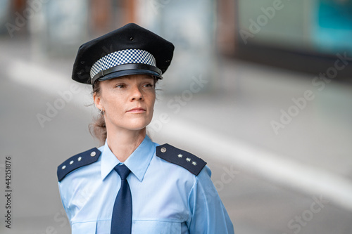 young woman female police officer on duty