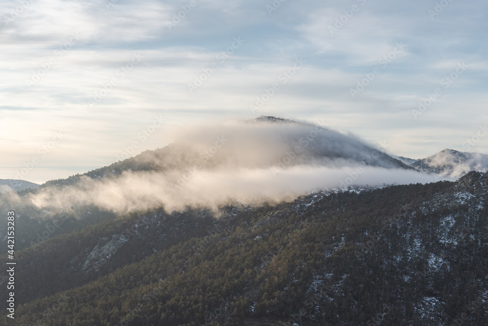 Mountains against cloudy morning sky Mountains against cloudy morning sky