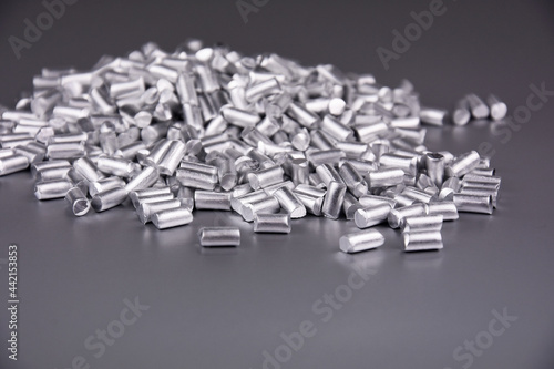 Fototapeta Naklejka Na Ścianę i Meble -  Pieces of pure aluminium metal stock images. Laboratory accessories stock photo. Laboratory equipment on a silver background. Al, chemical element stock images