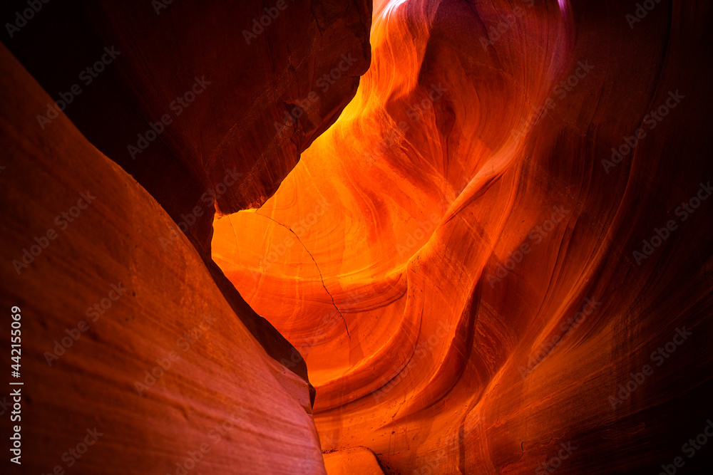 Looking up on upper Antelope slot canyon with red orange bright colorful layers of wave shape rock sandstone in Page, Arizona abstract background Looking up on upper Antelope slot canyon with red orange bright colorful layers of wave shape rock sandstone in Page, Arizona abstract background