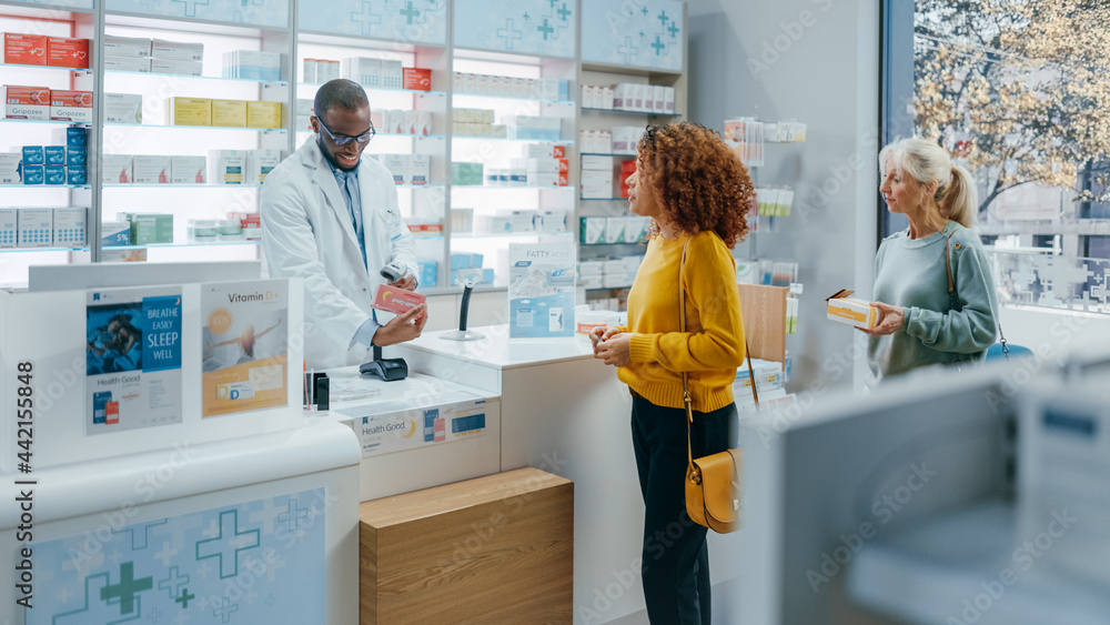 Pharmacy Drugstore Checkout Counter: Professional Black Pharmacist Provides Best Customer Service to Diverse Group of Multi-Ethnic Clients Buying Medicine Paying with Contactless Payment Credit Cards