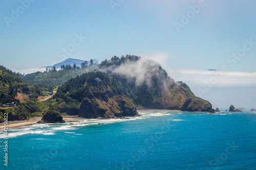 Incredible landscape of the coast. Beautiful blue sea. The waves rolled ashore and breaking on the sand beach. View From Octopus Tree Trail, Oregon, USA