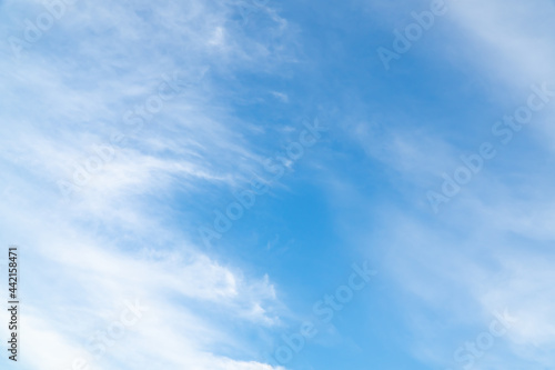 Summer Blue Sky and white cloud white background. Beautiful clear cloudy in sunlight spring season. vivid cyan cloudscape in nature environment. Outdoor horizon skyline with spring sunshine.