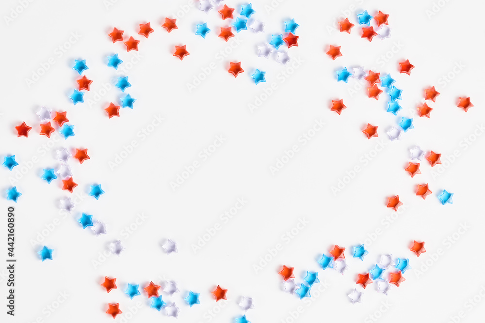 beautiful frame of blue, red and transparent stars on a white background. banner for the celebration of Independence Day on July 4th. space for text, flat lay