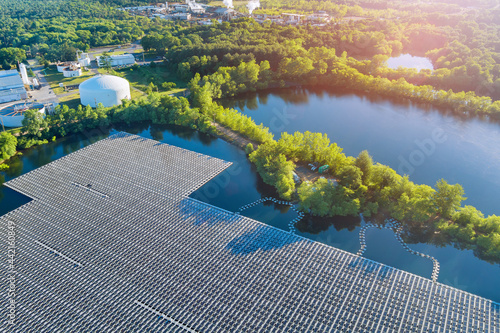 Panorama aerial view of floating farm solar panels cell park platform system on the lake