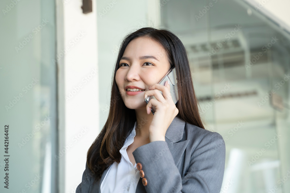 Happy Confident young asian businesswoman use the smartphone. business successful technology Happy Confident young asian businesswoman use the smartphone. business successful technology