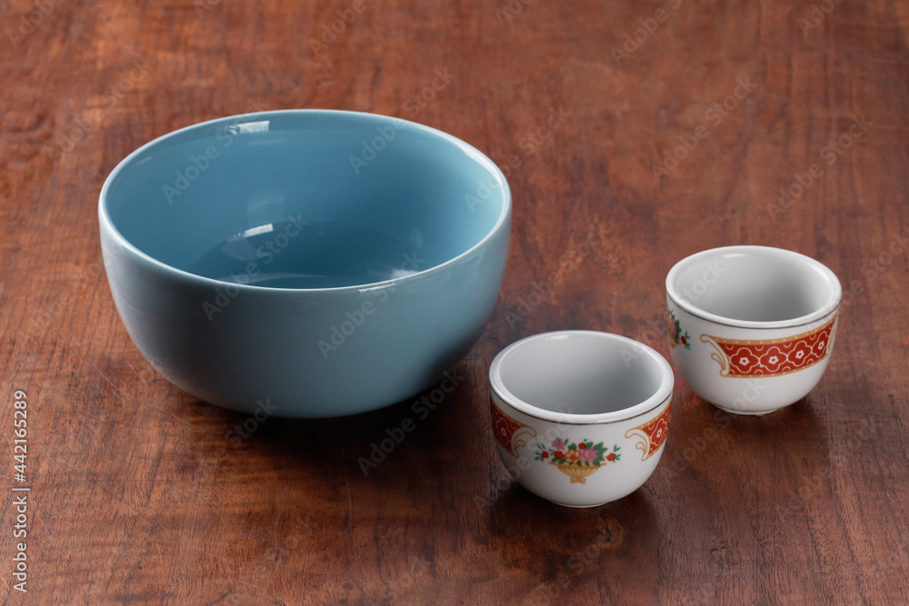 one empty blue bowl and two empty cups of classic chinese tea one empty blue bowl and two empty cups of classic chinese tea
