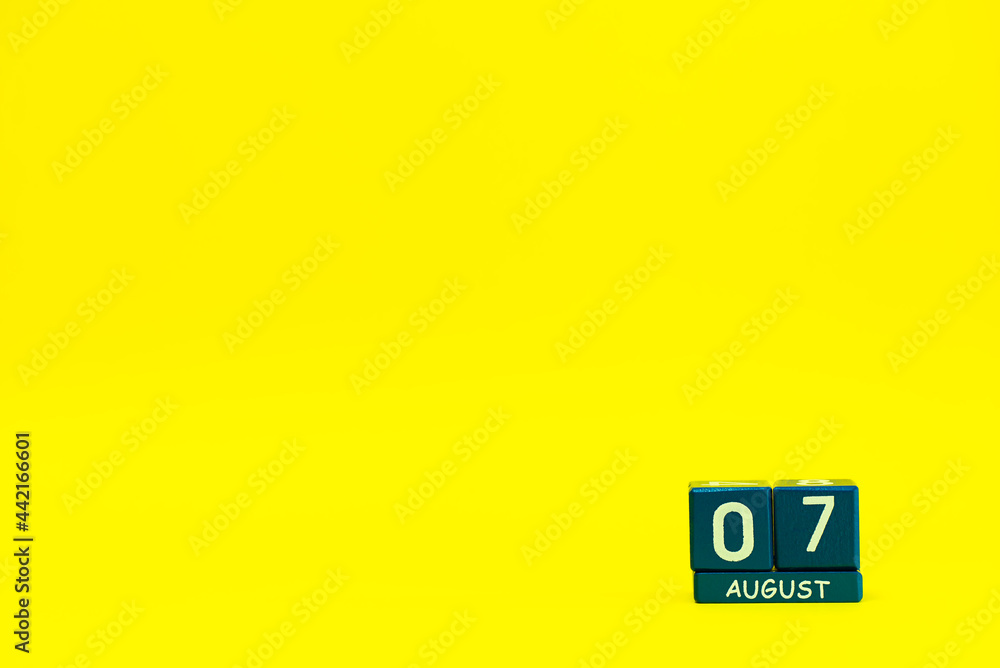 Date 07 August on blue wooden cubes on a bright yellow background with place for text
Date 07 August on blue wooden cubes on a bright yellow background with place for text