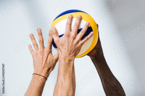 Volleyball game. Beach volleyball block. photo