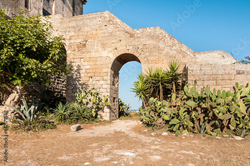 View of the historical fortification tower - Torre Colimena in village Manduria, province of Taranto, Puglia, Italy