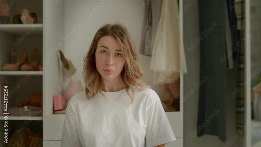 girl looking at the camera on the background of the dressing room girl looking at the camera on the background of the dressing room