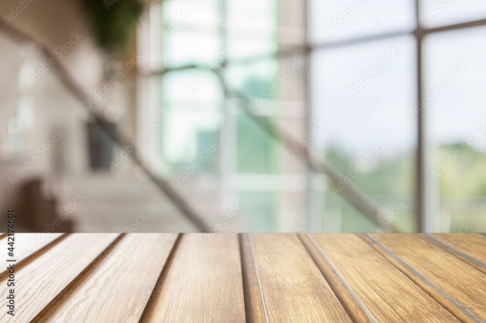 Empty wooden table top with lights on blur restaurant background. Empty wooden table top with lights on blur restaurant background.