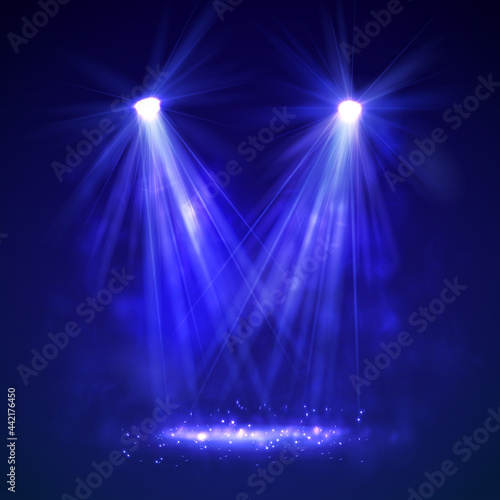 Spotlight on stage with smoke and light.