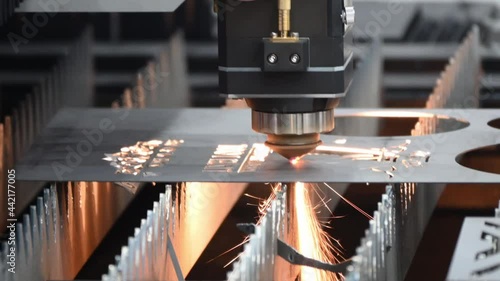 The fiber laser cutting machine cutting  machine cut the metal plate. The hi-technology sheet metal manufacturing process by laser cutting machine.