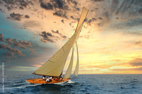 Sailboat sailing in the Mediterranean Sea at sunset