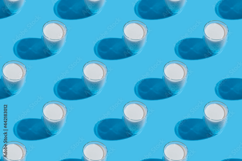 World Milk Day. Pattern on a blue background. A glass of milk. Template. Seamless pattern
