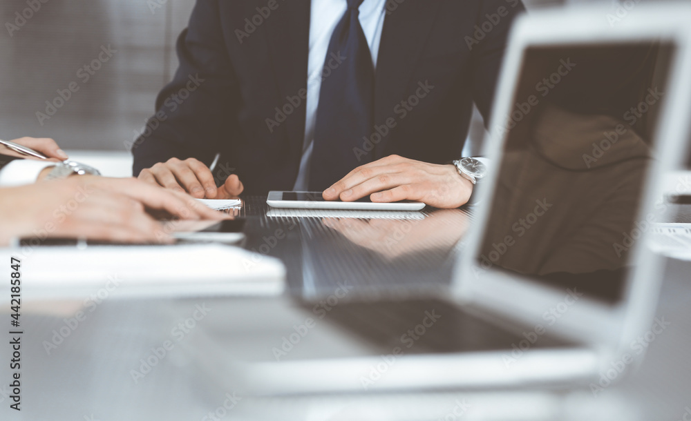 Business people working together at meeting in a modern office. Unknown businessman and woman with colleagues or lawyers at negotiation about contract Business people working together at meeting in a modern office. Unknown businessman and woman with colleagues or lawyers at negotiation about contract