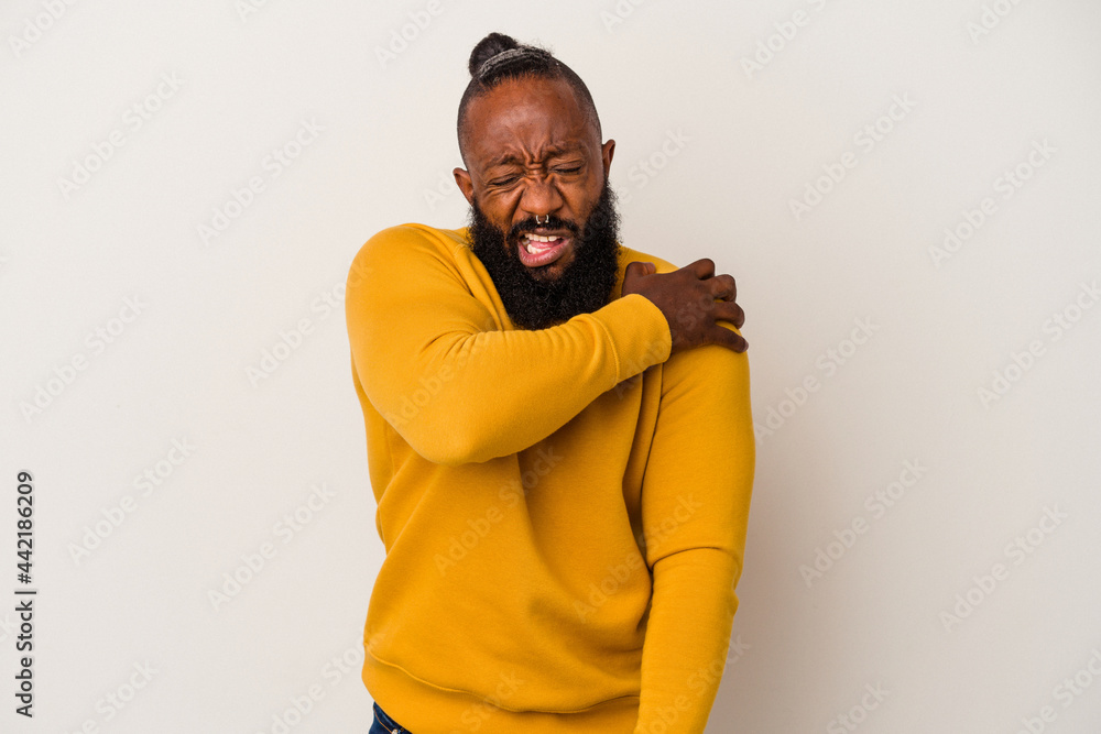 Obraz premium African american man with beard isolated on pink background having a shoulder pain.
