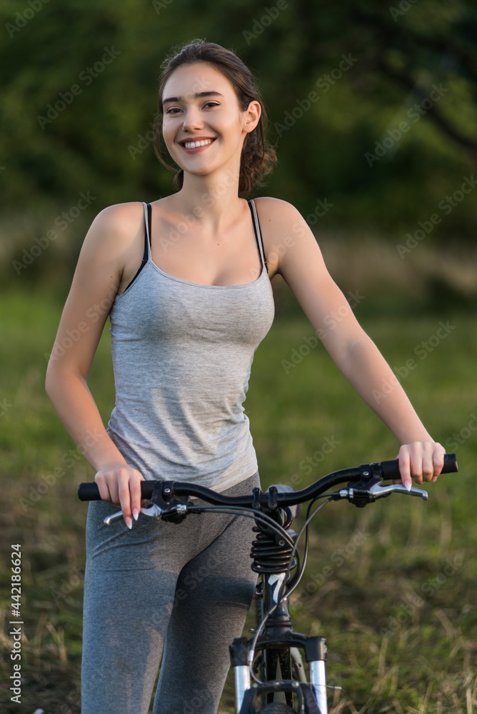 Fototapeta premium Cyclist on natural summer background outdoor