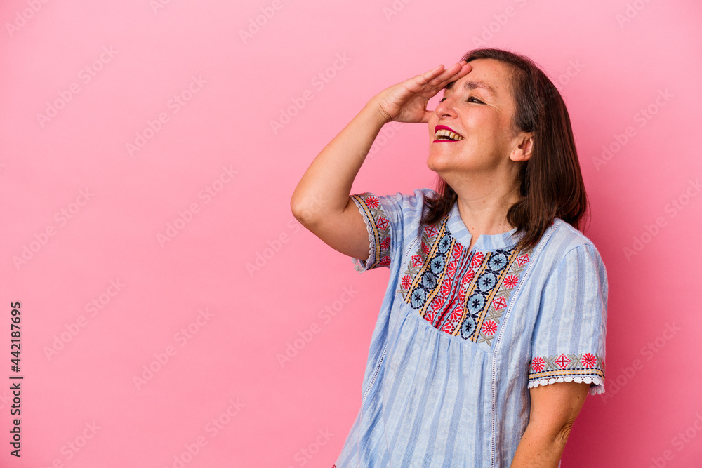 Middle age caucasian woman isolated on pink background laughing happy, carefree, natural emotion. Middle age caucasian woman isolated on pink background laughing happy, carefree, natural emotion.