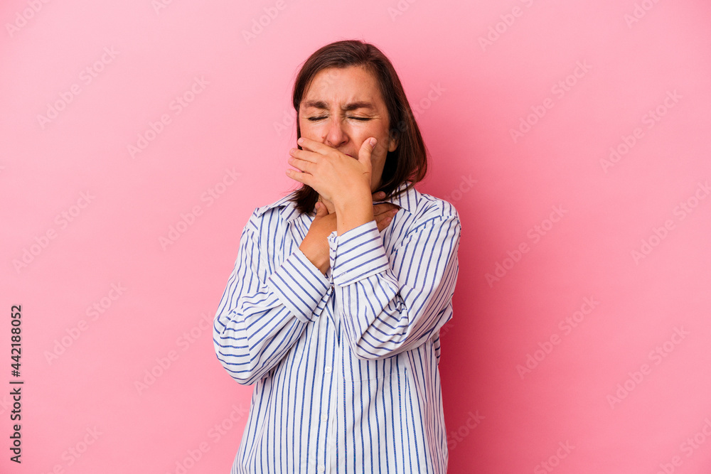 Middle age caucasian woman isolated on pink background suffers pain in throat due a virus or infection. Middle age caucasian woman isolated on pink background suffers pain in throat due a virus or infection.