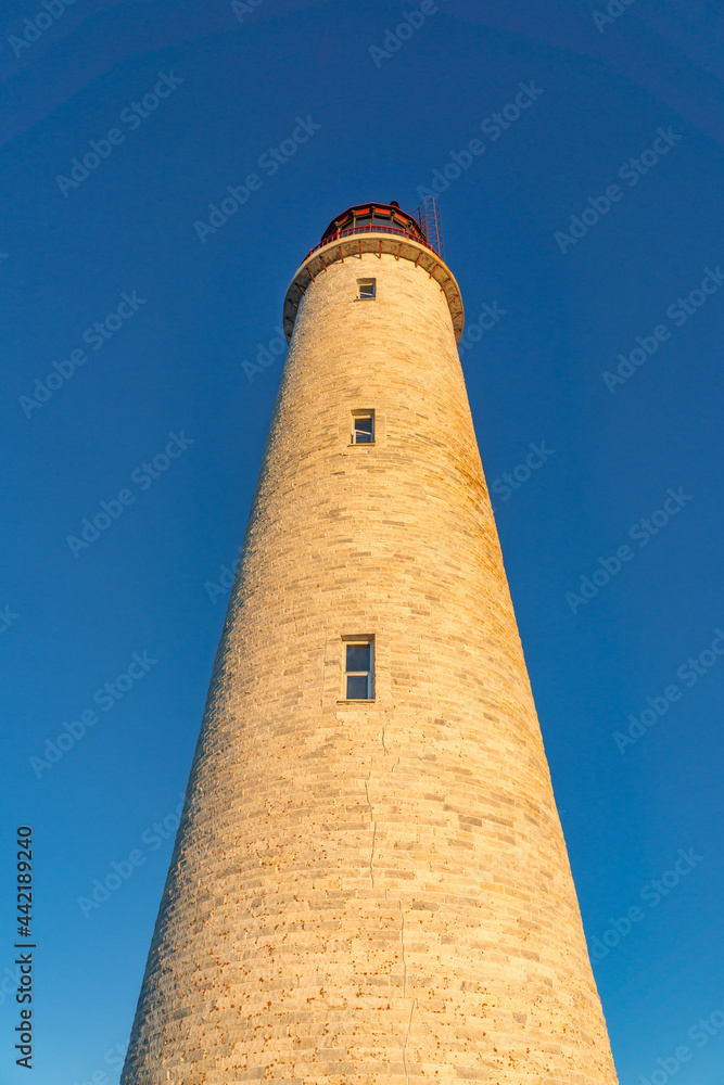 Close up view of the tower and the beacon of the Cap des Rosiers lighthouse, the highest in Canada, located near Forillon National Park n Quebec