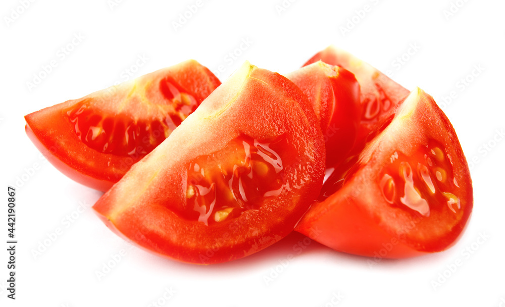 Pieces of ripe red tomato are isolated on a white background. Full clipping path. Pieces of ripe red tomato are isolated on a white background. Full clipping path.