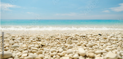 Fototapeta Naklejka Na Ścianę i Meble -  Low angle view of beautiful beach with round pebbles