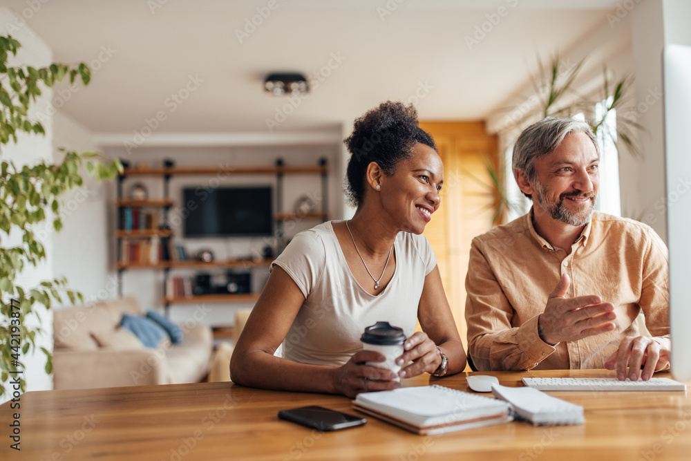 Adult couple, browsing apartments online.