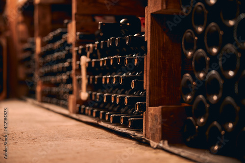Wine bottles with corks stored in wine cellar