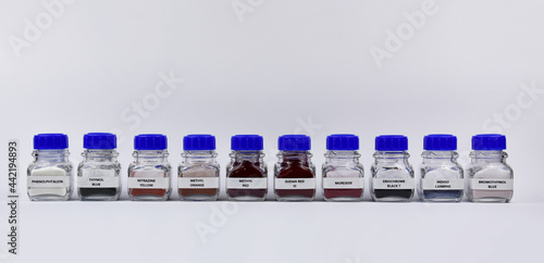 Ph and redox indicators stock images. Laboratory accessories images. Laboratory equipment on a white background. Chemicals reagents in a row in glass bottles stock photo. Powder ph indicator images