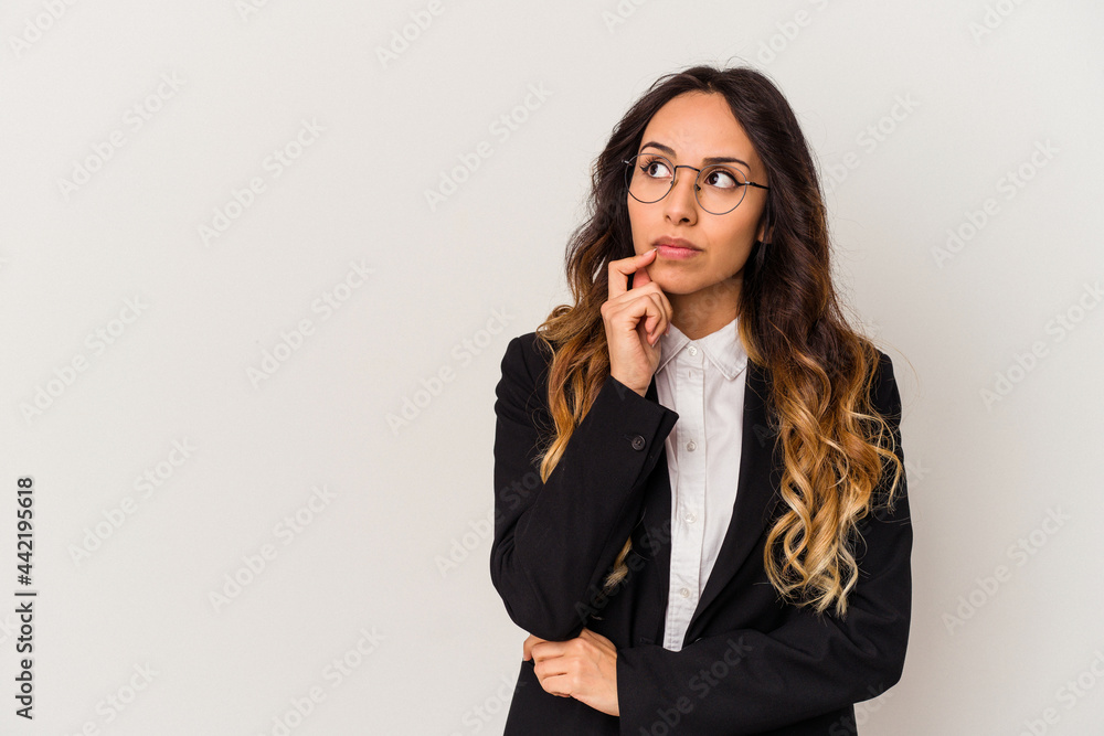 Young mexican business woman isolated on white background looking sideways with doubtful and skeptical expression. Young mexican business woman isolated on white background looking sideways with doubtful and skeptical expression.