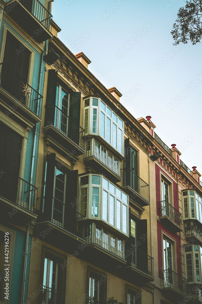 Facade window of a colored building on a street Facade window of a colored building on a street