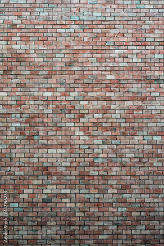 High brick wall on a street