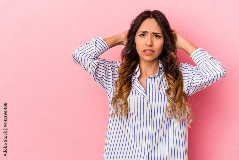 Young mexican woman isolated on pink background touching back of head, thinking and making a choice. Young mexican woman isolated on pink background touching back of head, thinking and making a choice.